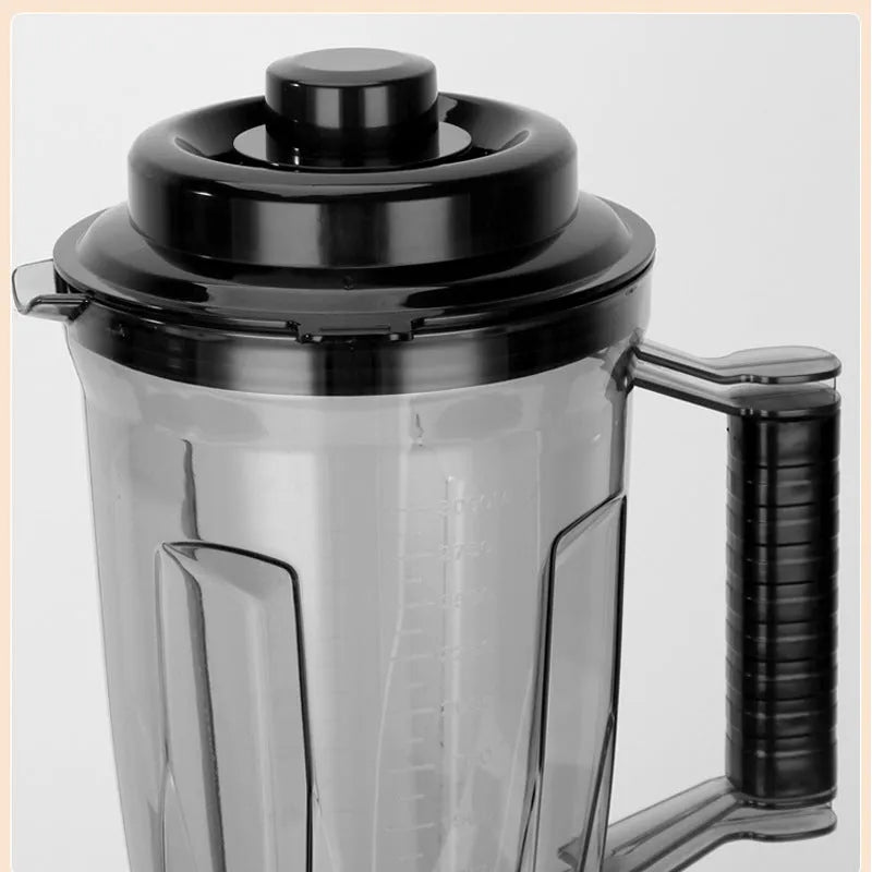 4L three-in-one grinding machine with juicer cup, minced meat cup, and grinding cup on a kitchen counter