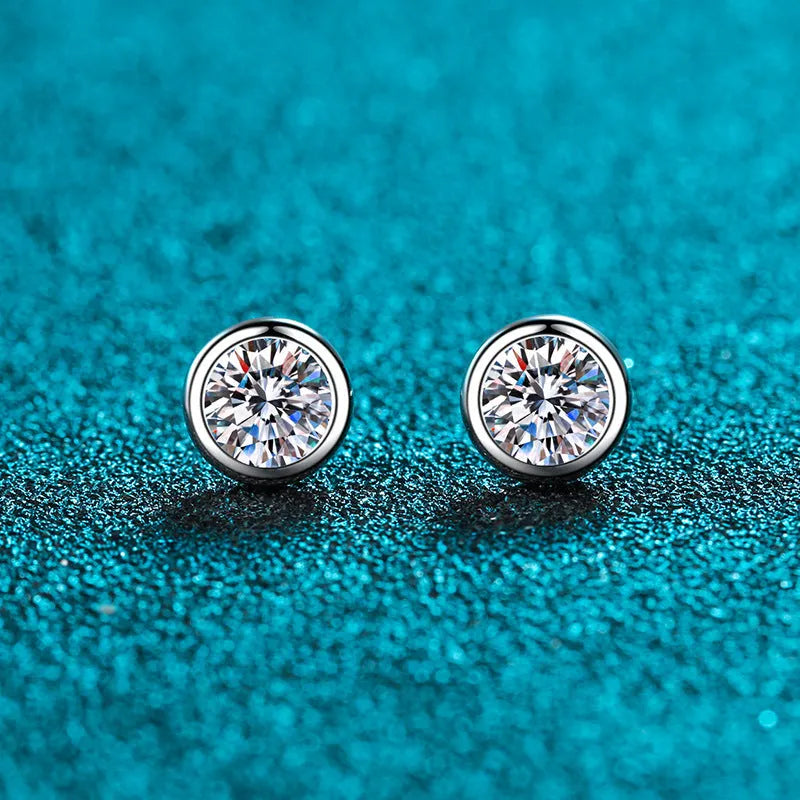 A pair of sterling silver earrings with geometric design and a choice of moissanite or zircon stone.
