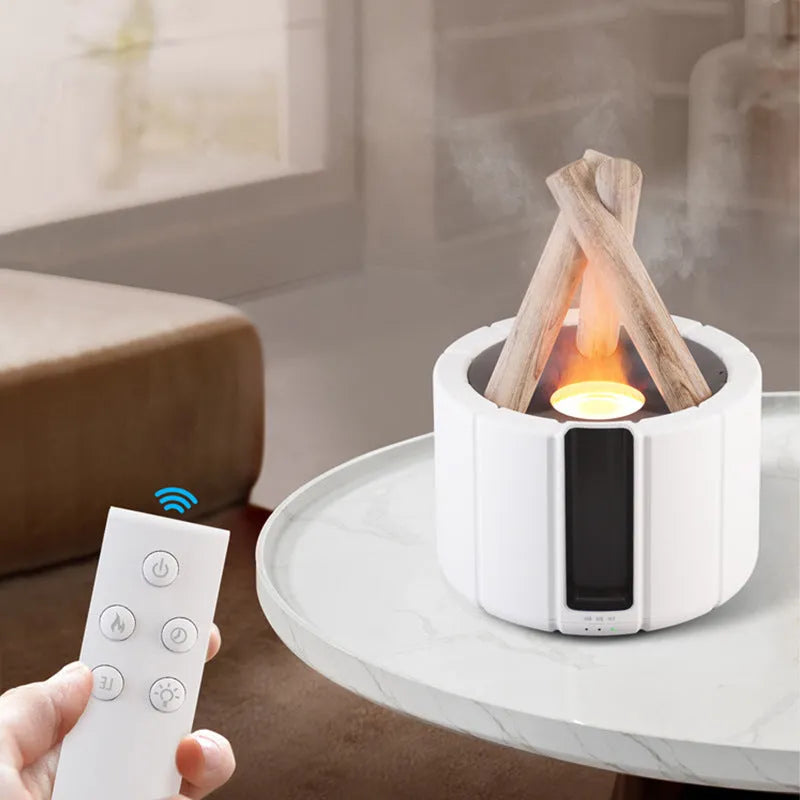 Simulated flame aromatherapy humidifier on a desk with USB cable and remote control