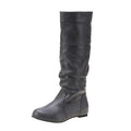 Women's flat slip-on ankle boots in black with a round toe and high-cut design on a neutral background.