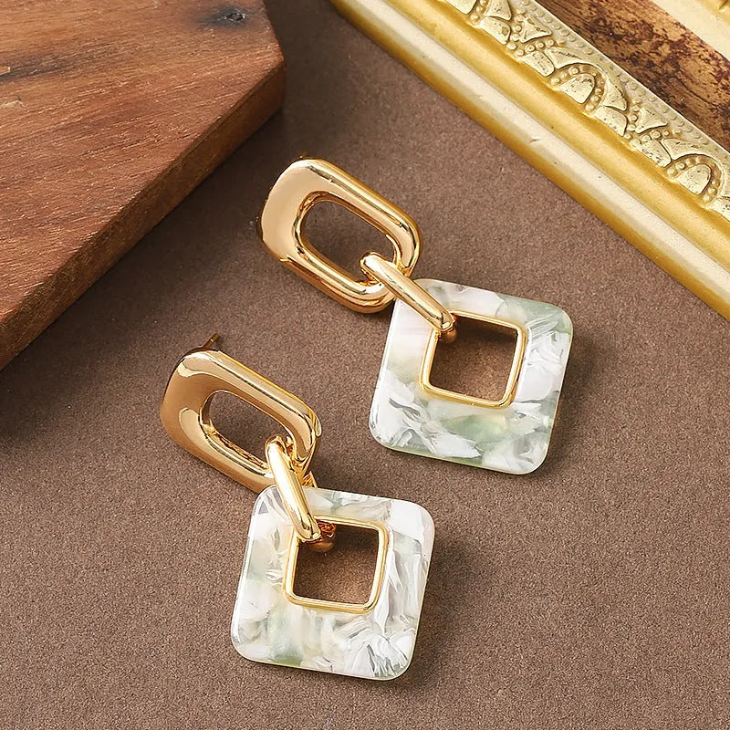 Copper geometric square earrings with hollow construction and chamfered pattern