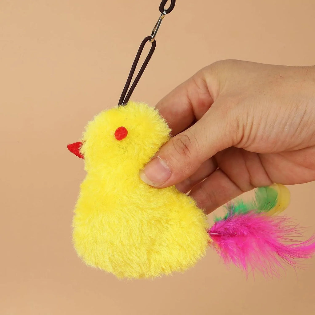 Interactive cat toy with swinging motion hanging from door frame featuring treat reward bulb and retractable elastic cord