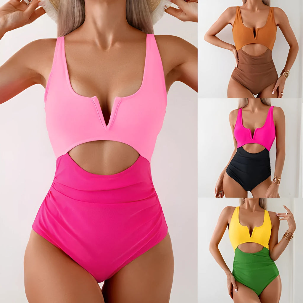 Women's green and black colour-block one-piece nylon swimsuit on a size mannequin.