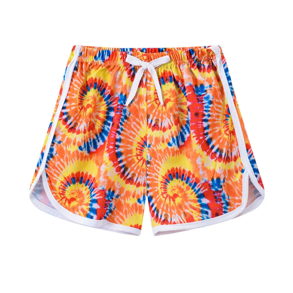 Children's colourful polyester shorts with elastic waistband, showing patterns like stripes, pineapples, and kittens.