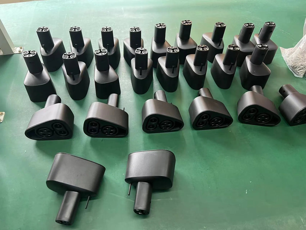 Black Tesla charging plug conversion adapter for J1772 connectors with dimensions 195mm x 96mm x 67mm