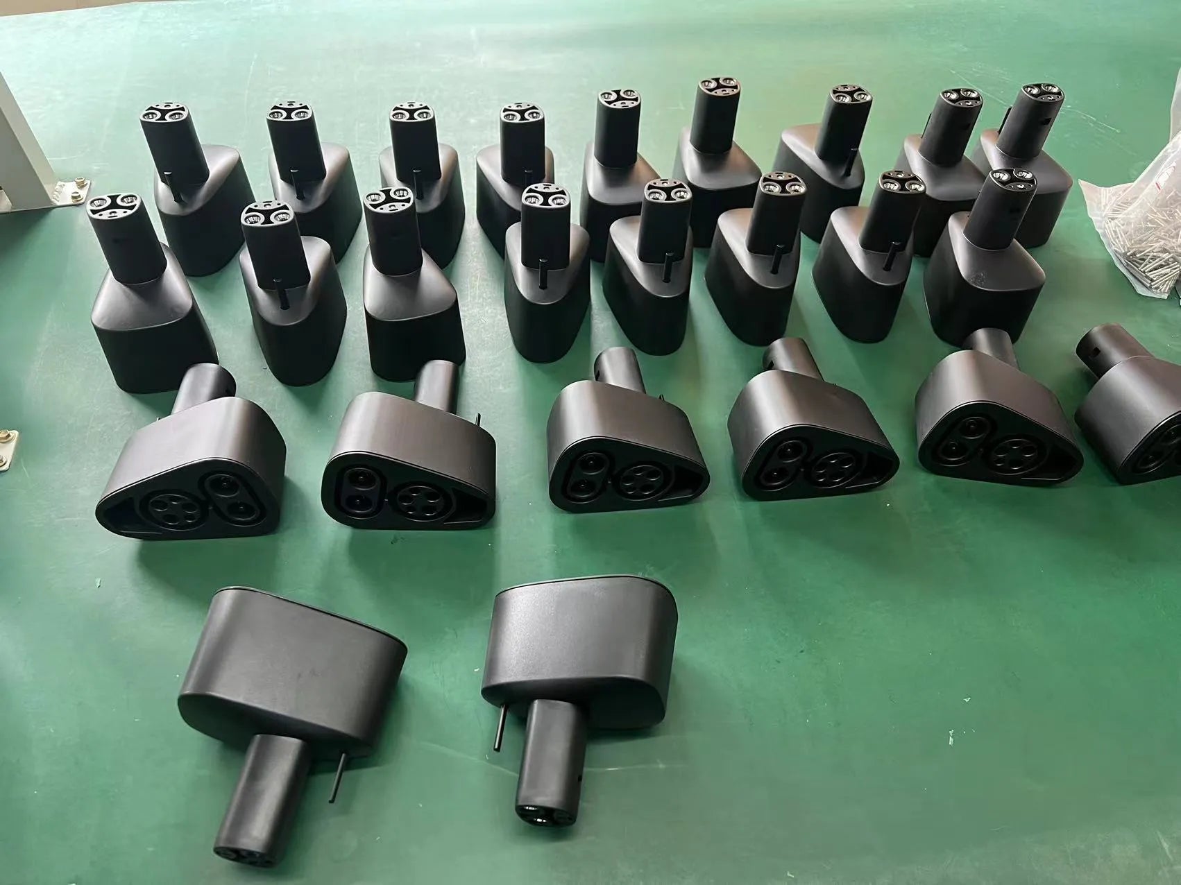 Black Tesla charging plug conversion adapter for J1772 connectors with dimensions 195mm x 96mm x 67mm