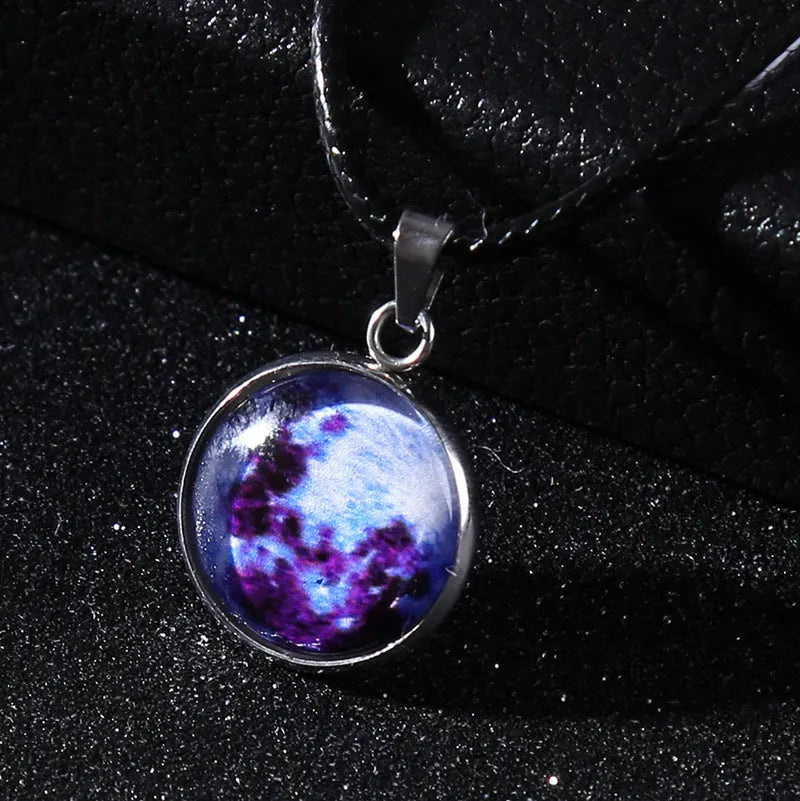 Luminous alloy necklace with a glass pendant depicting a Christmas moon night sky, showing the extension chain.