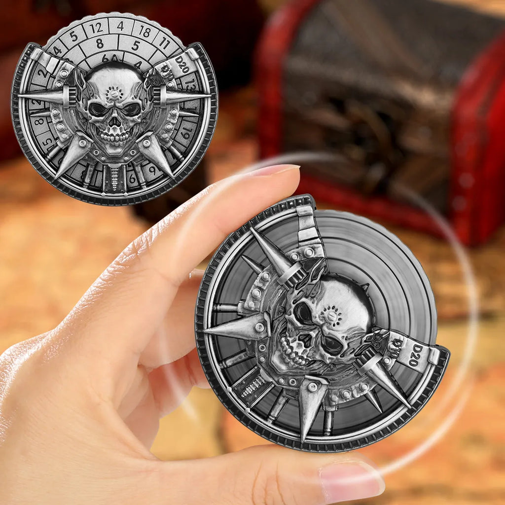 Skeleton metal wheel dice gift box with bronze D20 and D10 dice on a dark tabletop