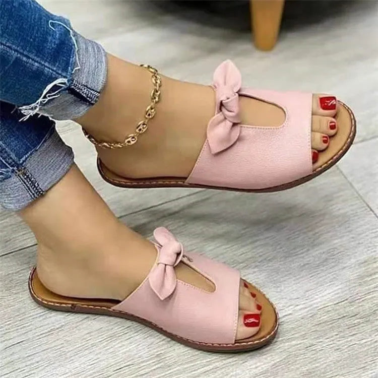 Women's black sandals with a fish mouth toe and decorative bow on the upper