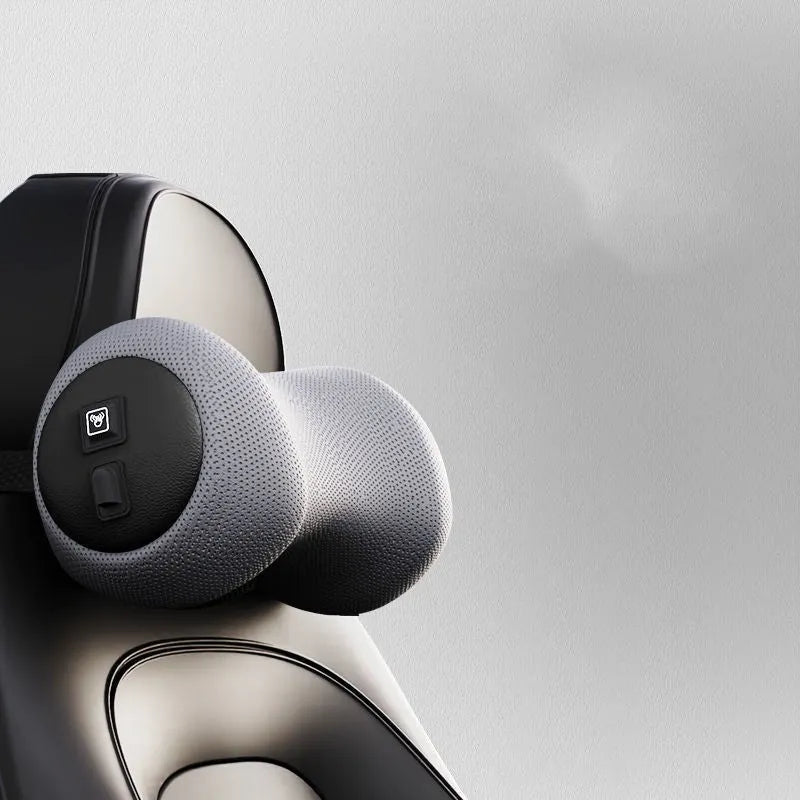 Car seat massage cushion and headrest set made from memory foam in a neutral colour.
