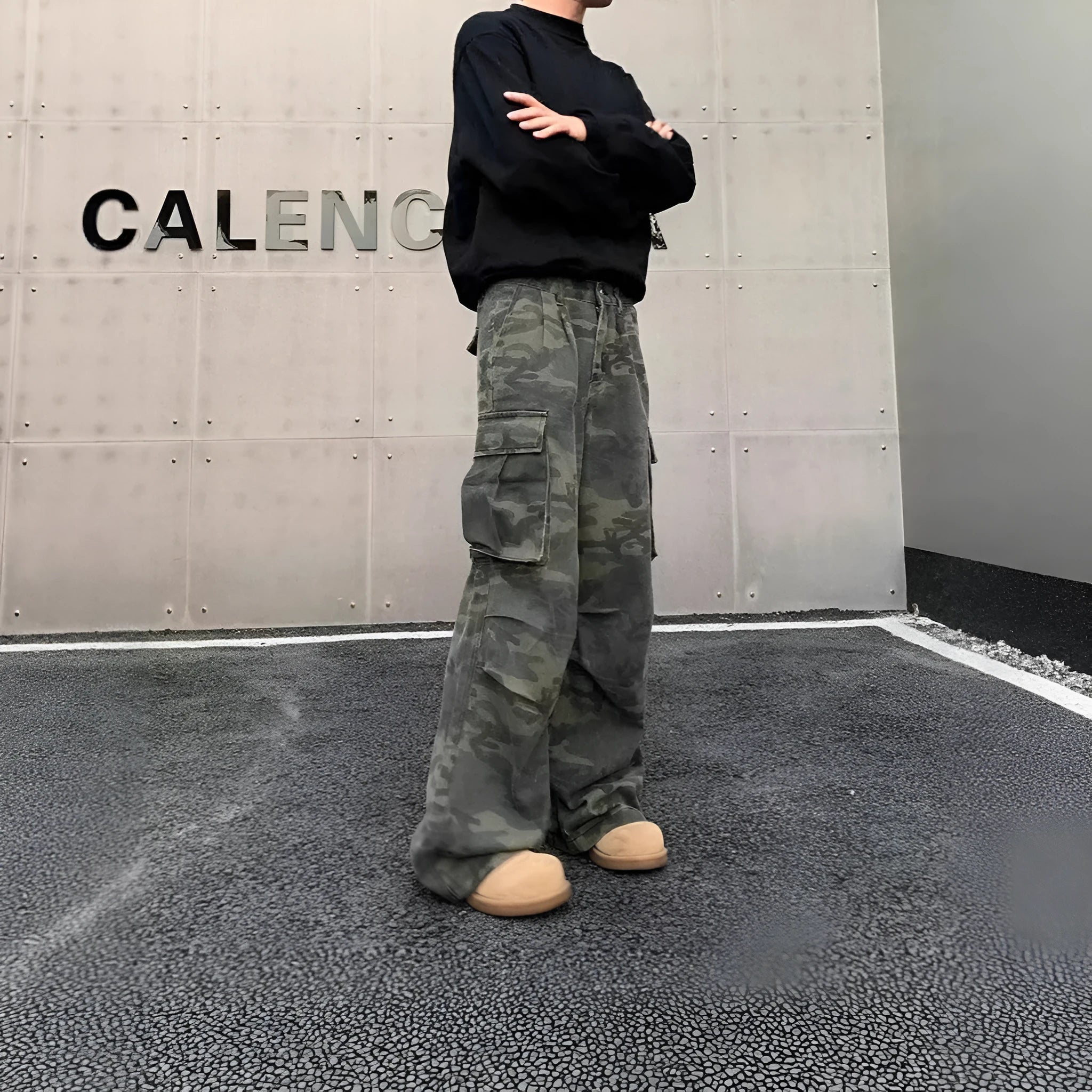 Vintage washed camouflage pattern cargo trousers with multiple pockets on a mid-waist fit.