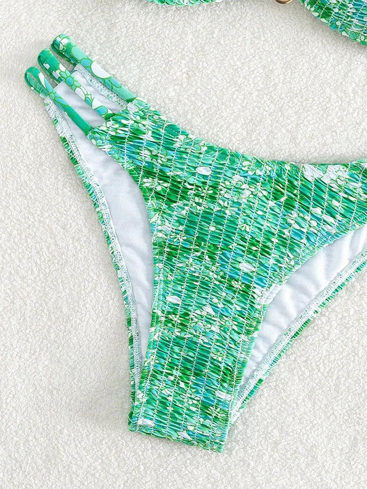Women's high-waist floral bikini swimsuit in a solid colour on a mannequin