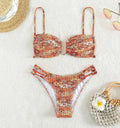 Women's high-waist floral bikini swimsuit in a solid colour on a mannequin