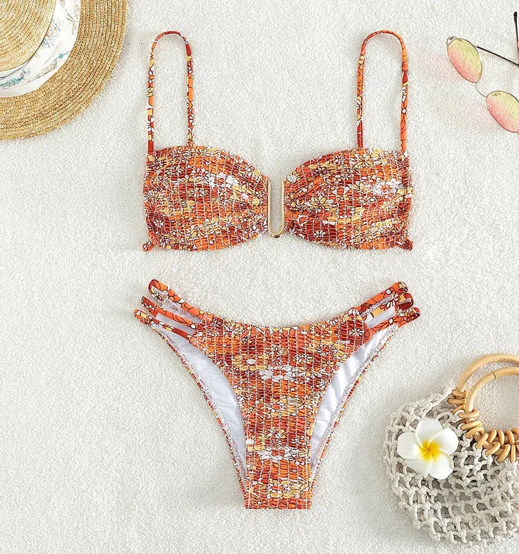 Women's high-waist floral bikini swimsuit in a solid colour on a mannequin