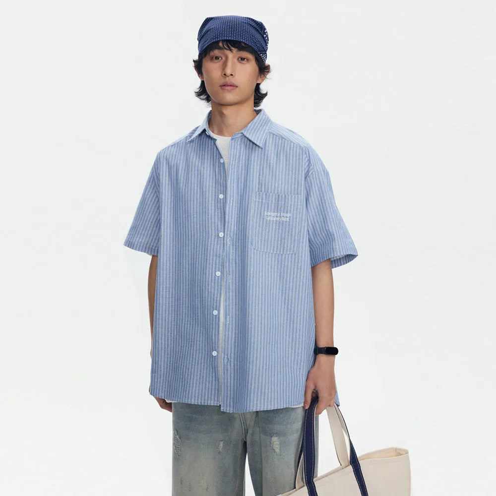 Blue striped short-sleeved overalls shirt in a loose cardigan style for casual wear.