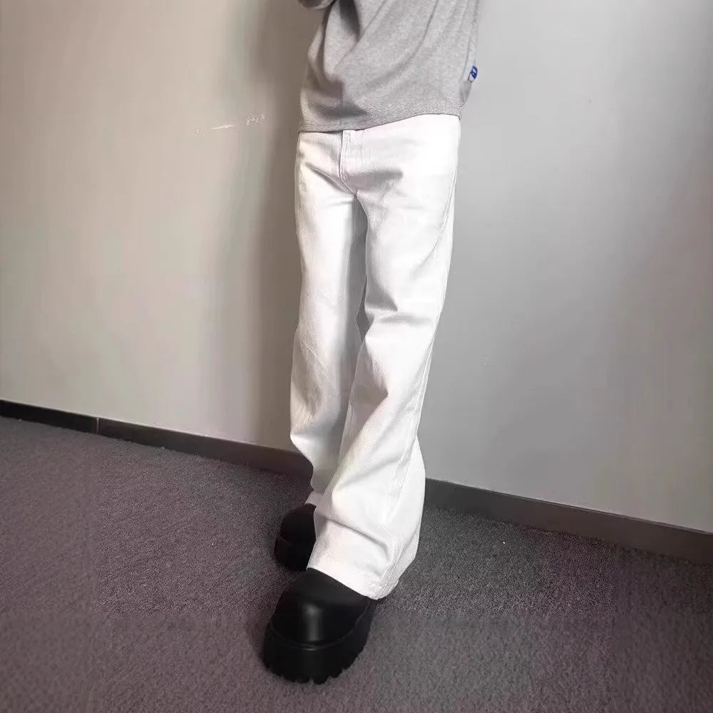 Men's loose straight leg white cotton denim jeans on a hanger.