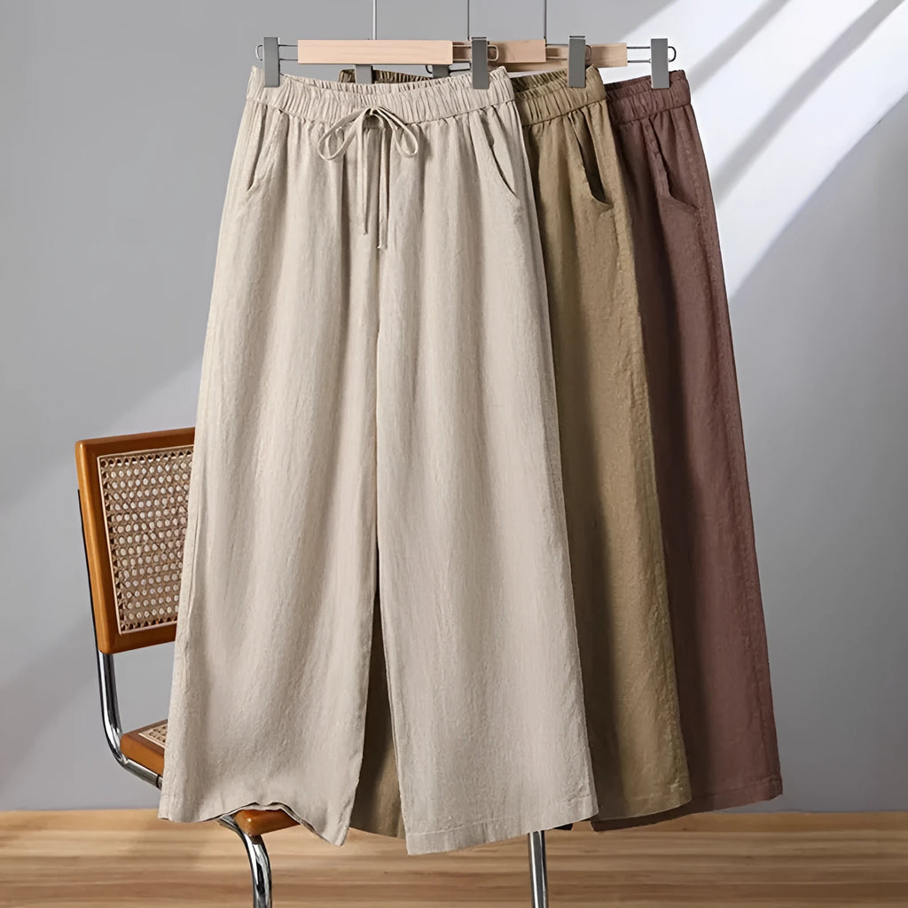 Women's straight-leg casual trousers with elastic waist and lace-up drawstring detail in polyester fabric