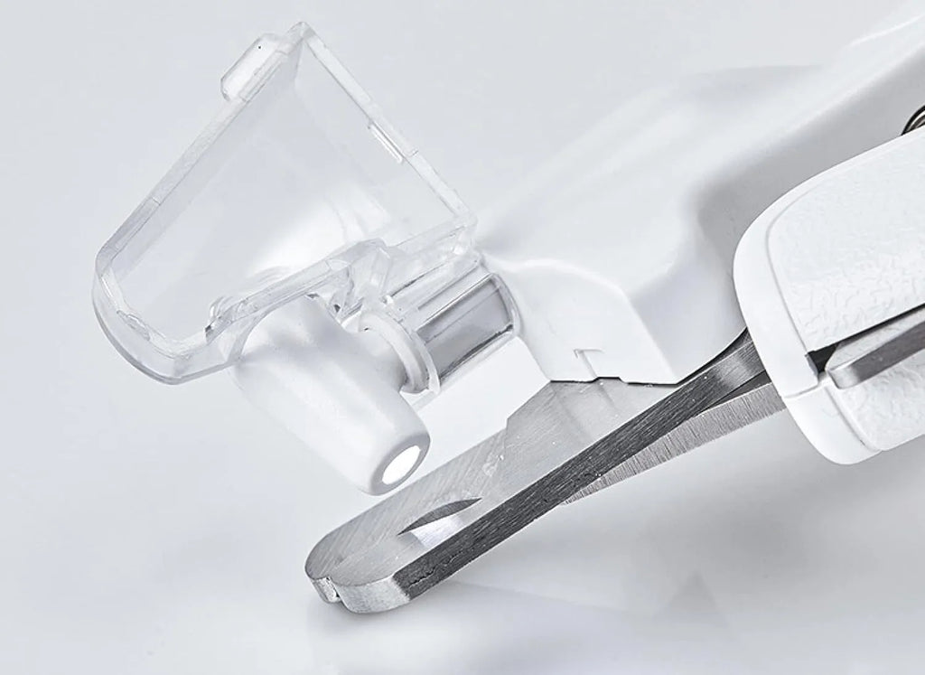 White pet nail clippers with LED light, transparent guard, triangular blades, and anti-slip handles for cat and dog grooming