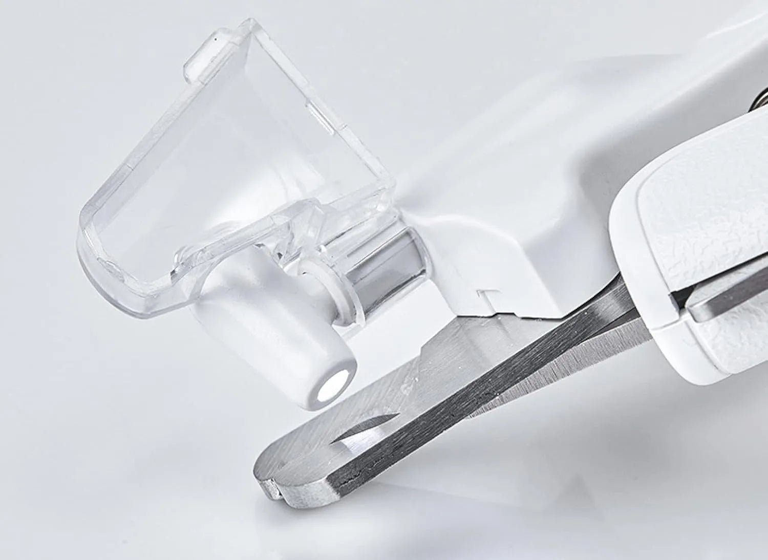 White pet nail clippers with LED light, transparent guard, triangular blades, and anti-slip handles for cat and dog grooming