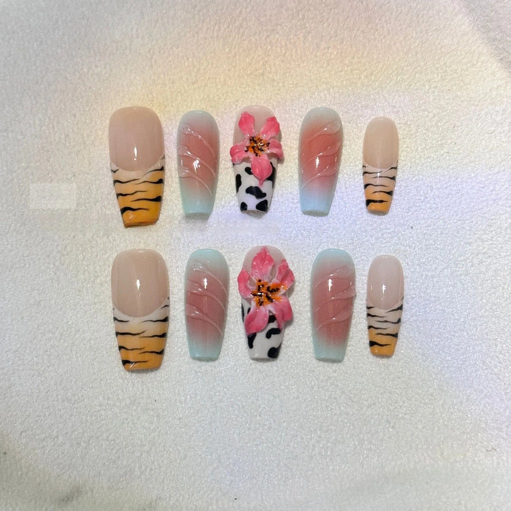 Set of zebra pattern lily hand-carved artificial nail tips with flower and leopard print designs in sizes XS to L