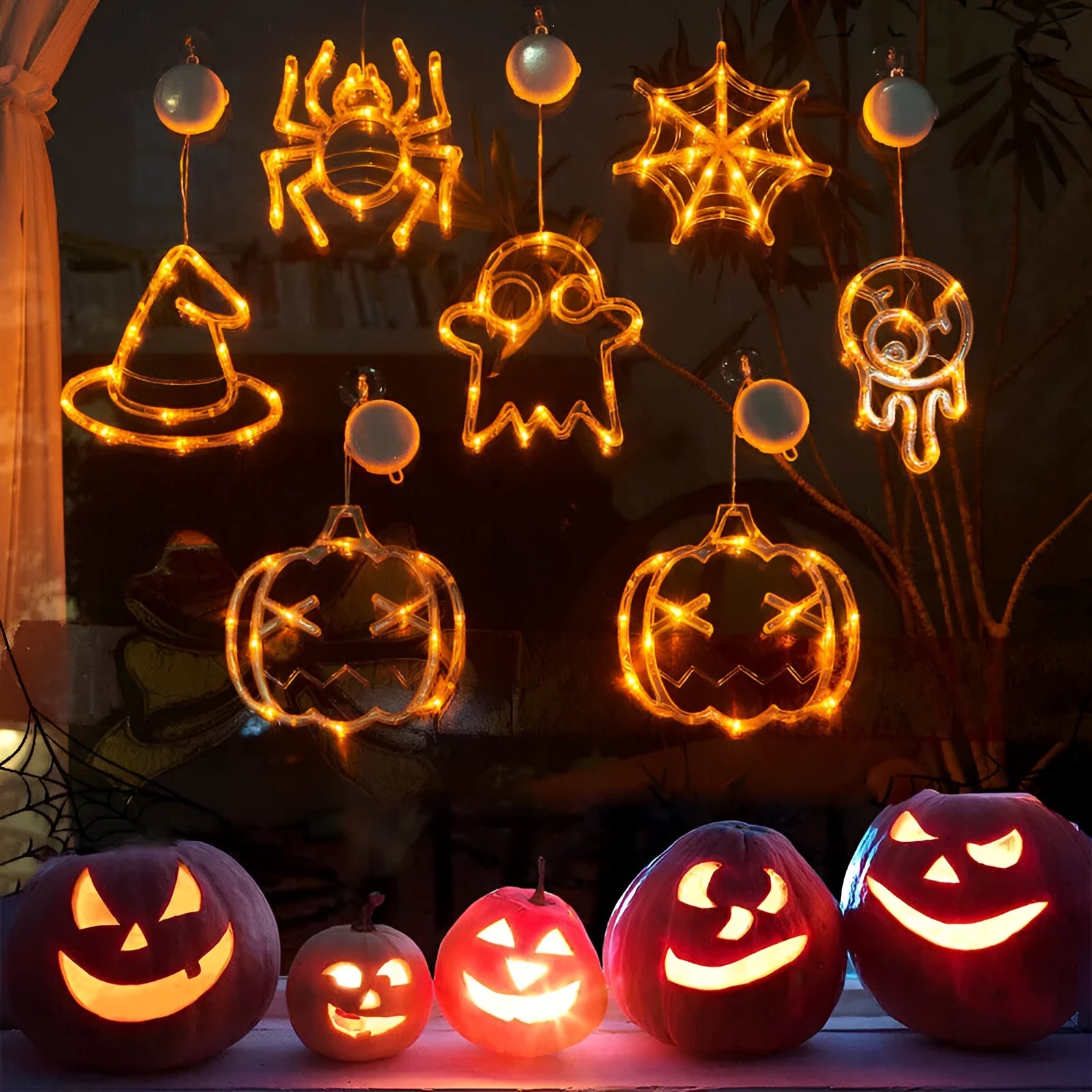 Seven Halloween LED window lights with spider, pumpkin, and ghost designs featuring suction cups for mounting