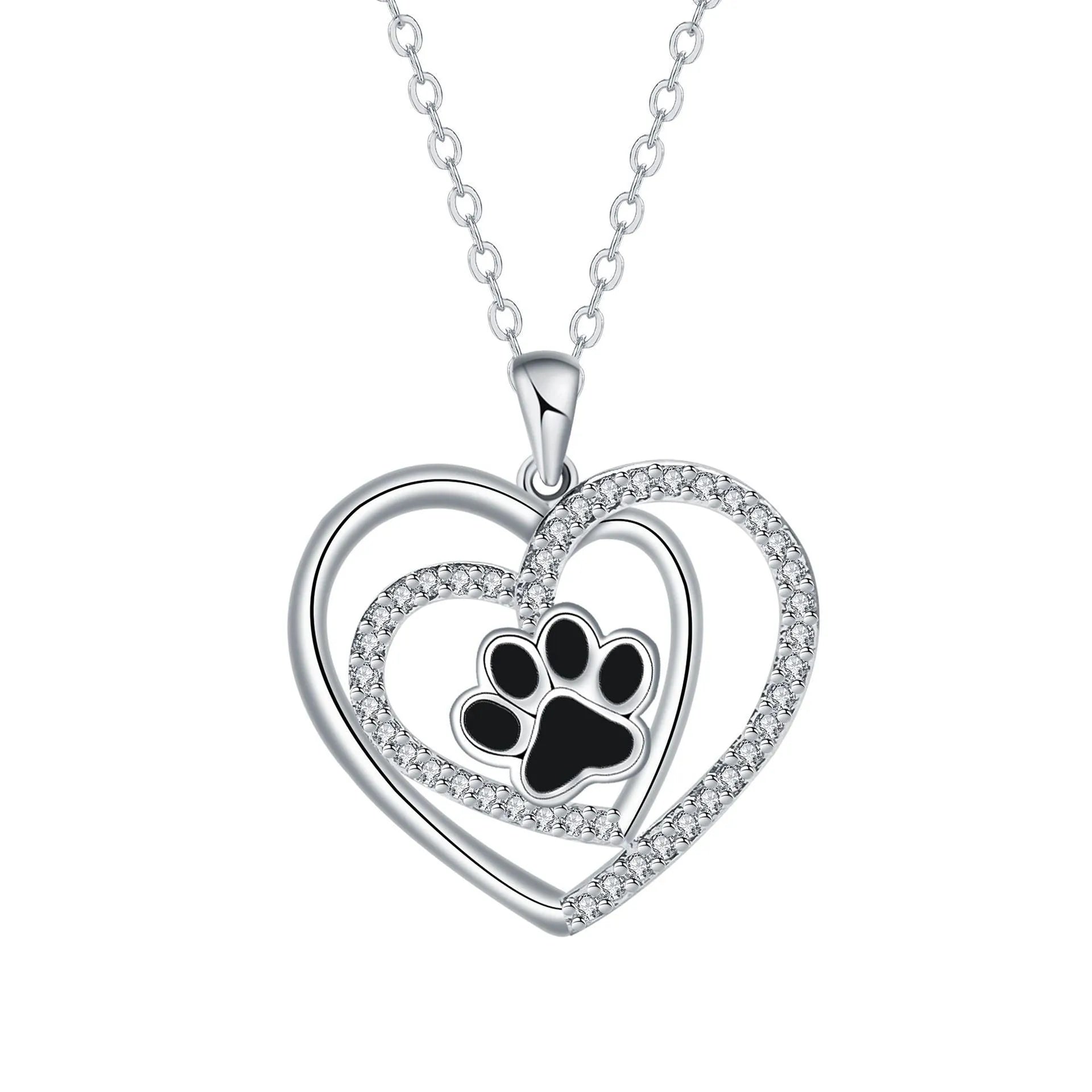 Gold tone dog paw print and heart charm necklace on a cross chain for women.