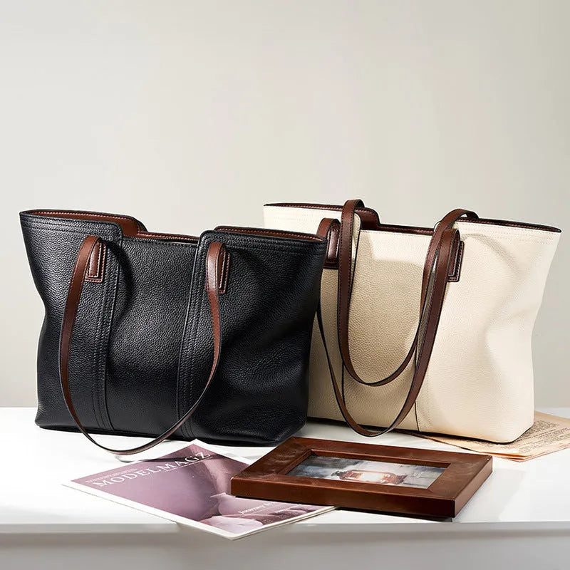 Women's black genuine leather commuter bag with multiple internal compartments in horizontal square shape