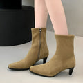 Brown women's square toe ankle boots with a side zipper and a kitten heel on a waterproof platform sole.