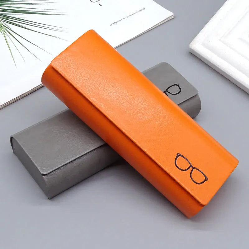 Leather glasses case in black, blue, grey, orange, white, and pink with single compartment for one pair of glasses