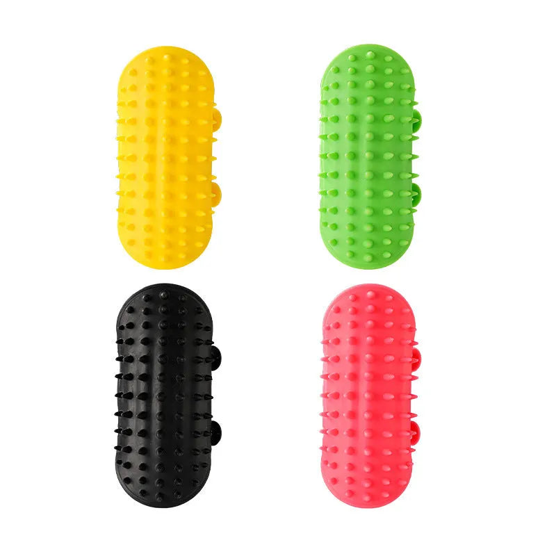 Silicone cat grooming massage comb with adjustable strap mounted on a table leg.