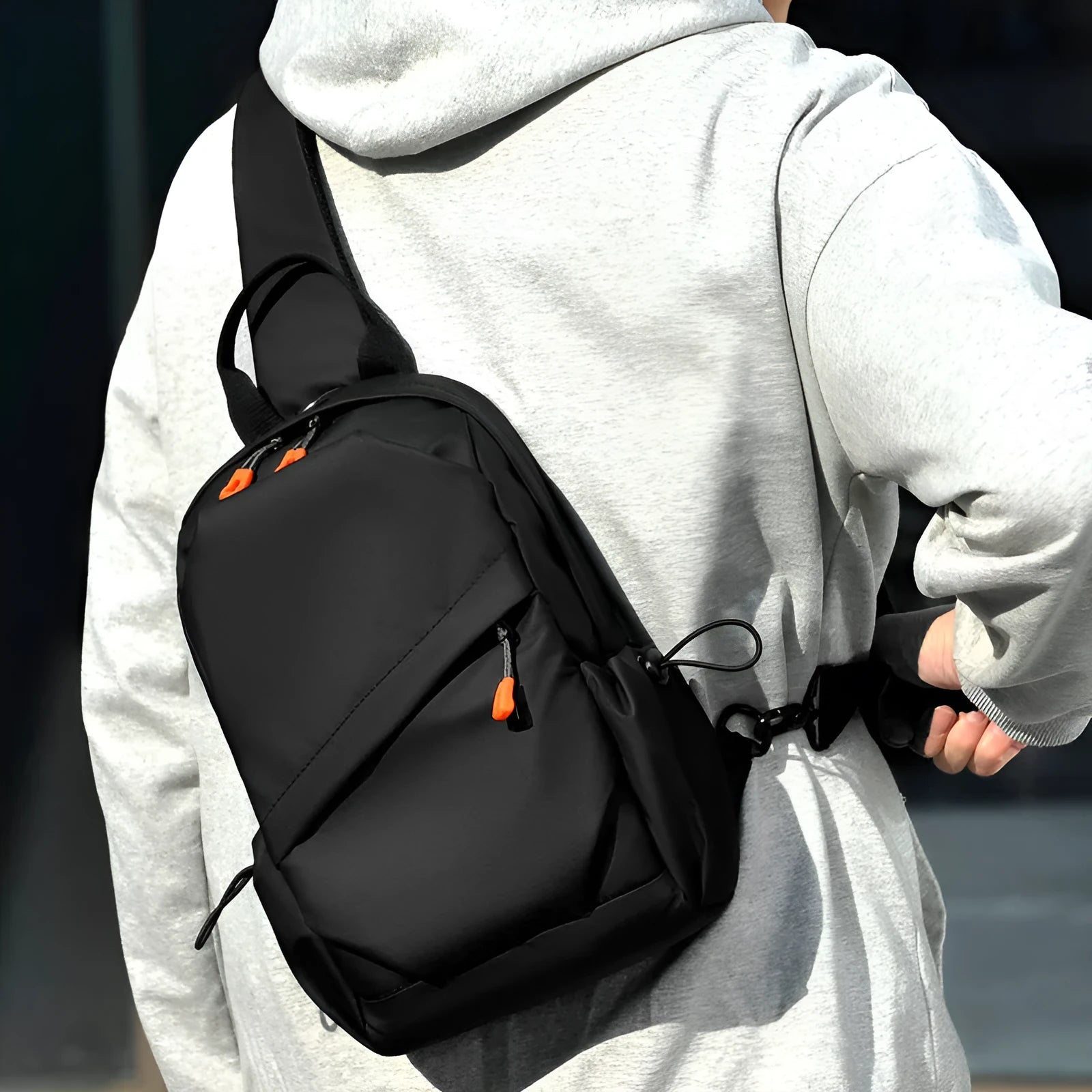 Black and grey mens casual single shoulder crossbody bag made of waterproof polyester.