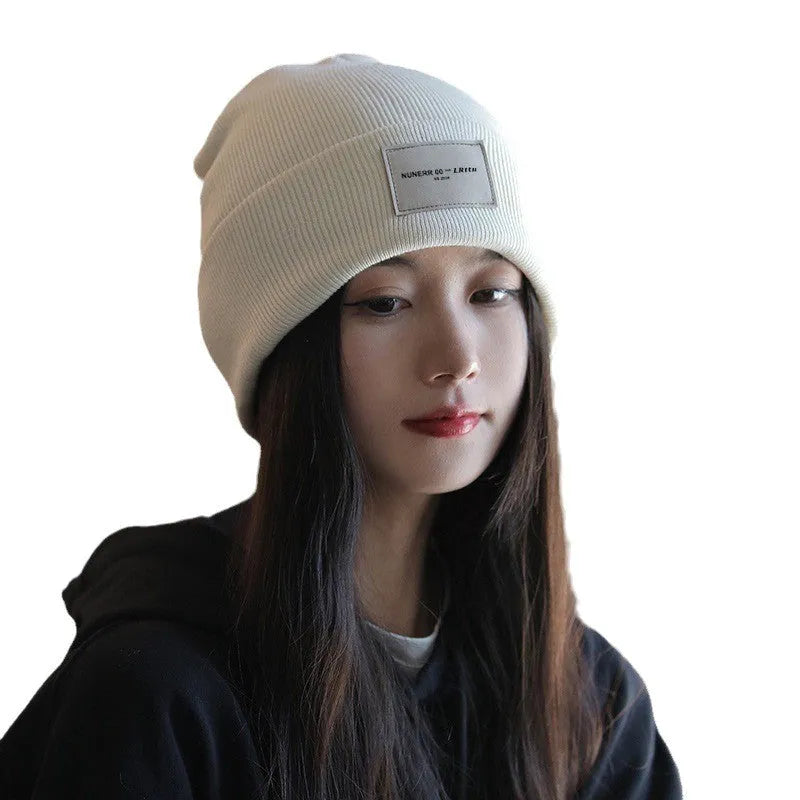 Women's knitted hat in dome crown style, polyester, available in pink, khaki, black, and beige for winter