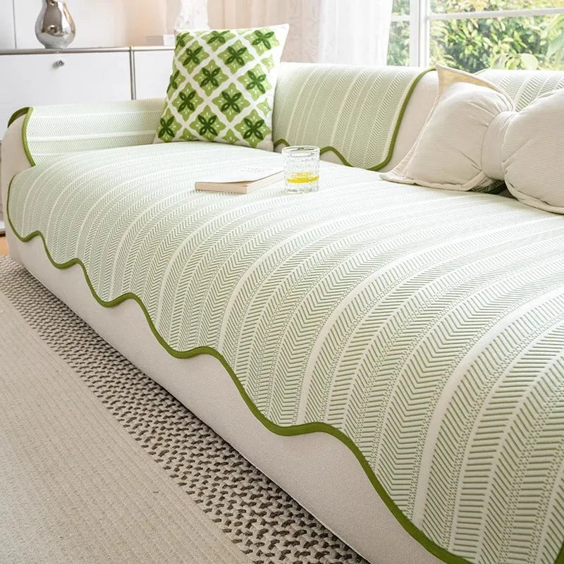 Ice silk fixed non-slip sofa cover in a special pattern, shown in jelly green colour on a couch.