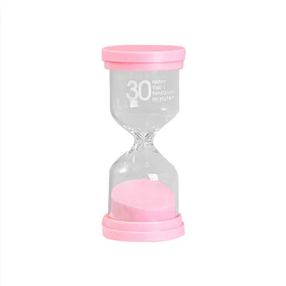 Handmade glass sand timer with blue sand, showing modern simplicity style on a desk.