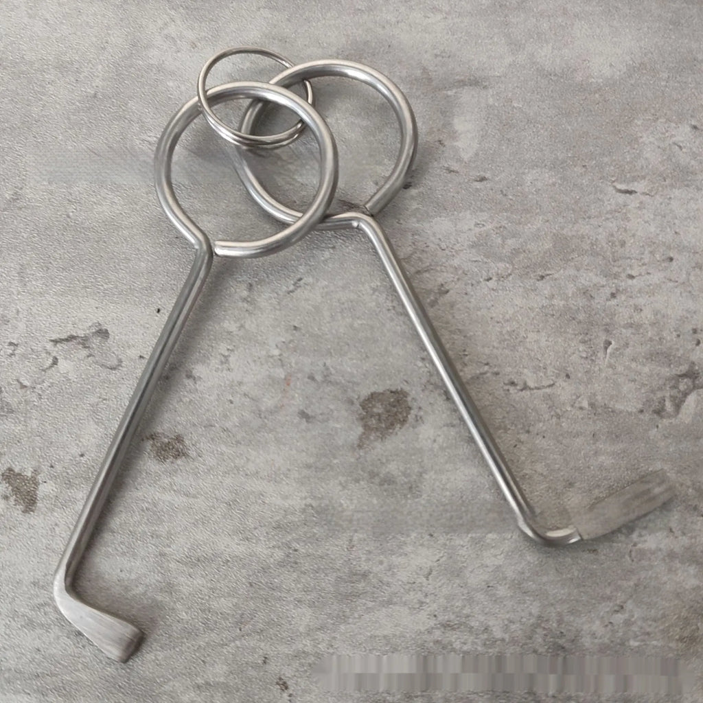 Two silver alloy universal wrench tools side by side on a surface.