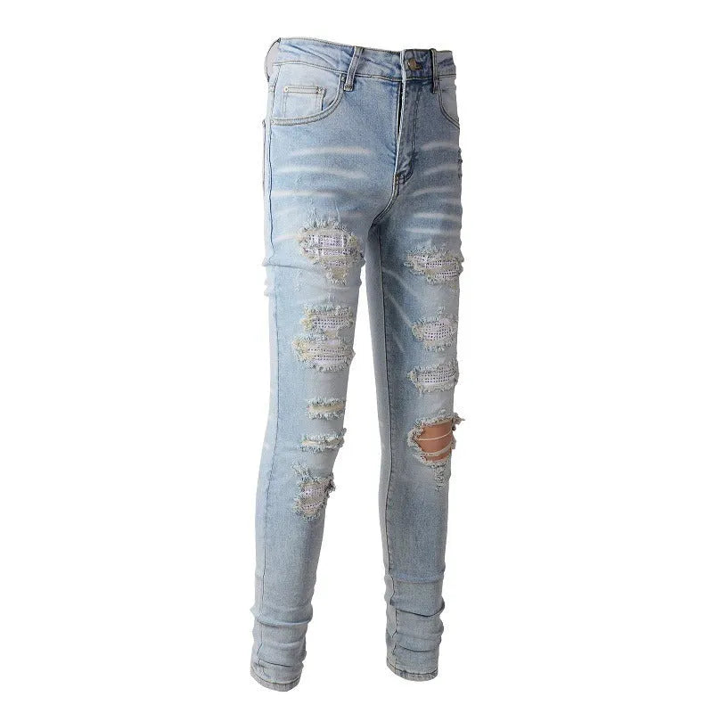 Light blue elastic tight fit jeans for men with patchwork and cat whisker finish