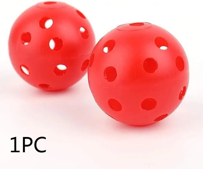 Multi-coloured golf practice balls in net storage pocket for putting training