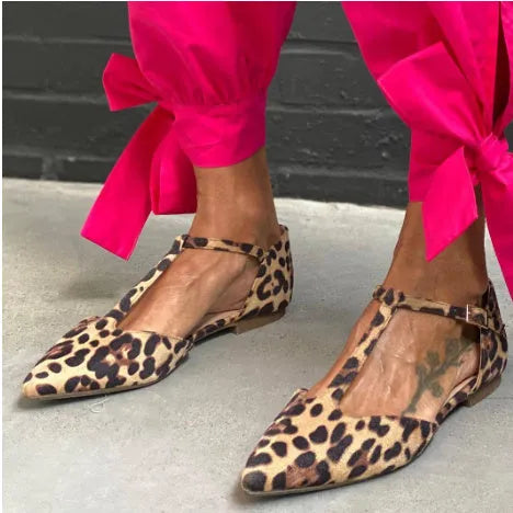 Leopard print women's pumps with pointed toe, chunky low heel, and ankle strap
