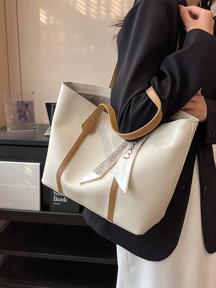 Large capacity bucket style tote bag with crossbody strap in multiple colour options