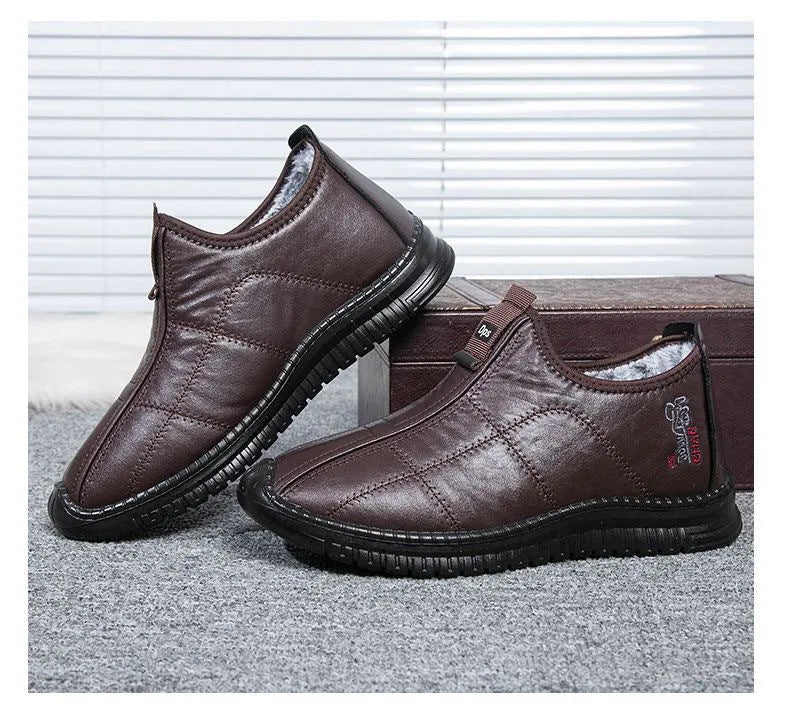 Men's brown winter cotton boots with a buckle closure and a thick, treaded non-slip sole.