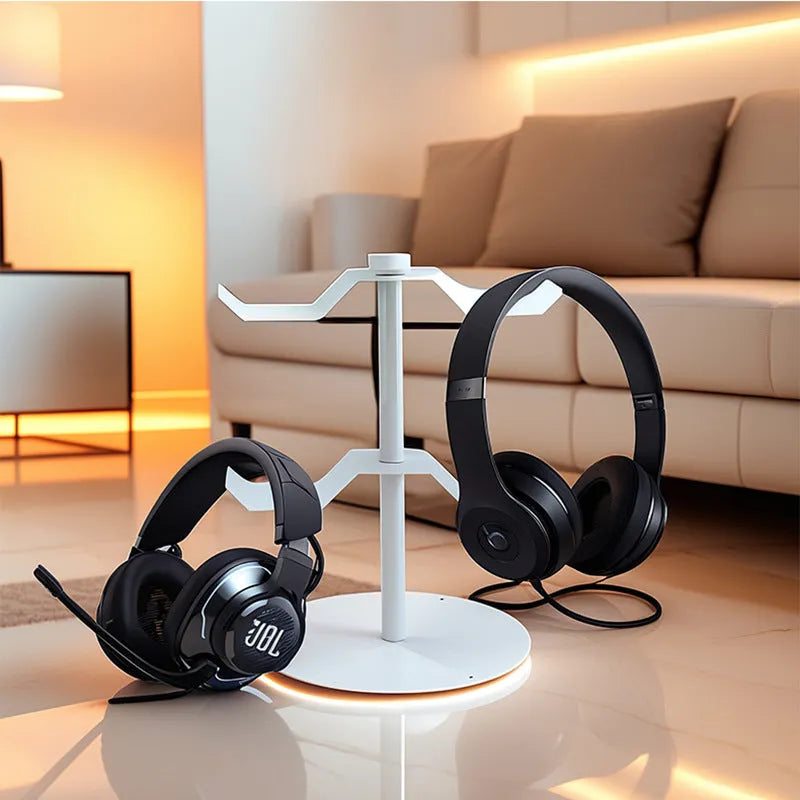 Black two-layer metal headphone bracket holding gaming headsets on a desk