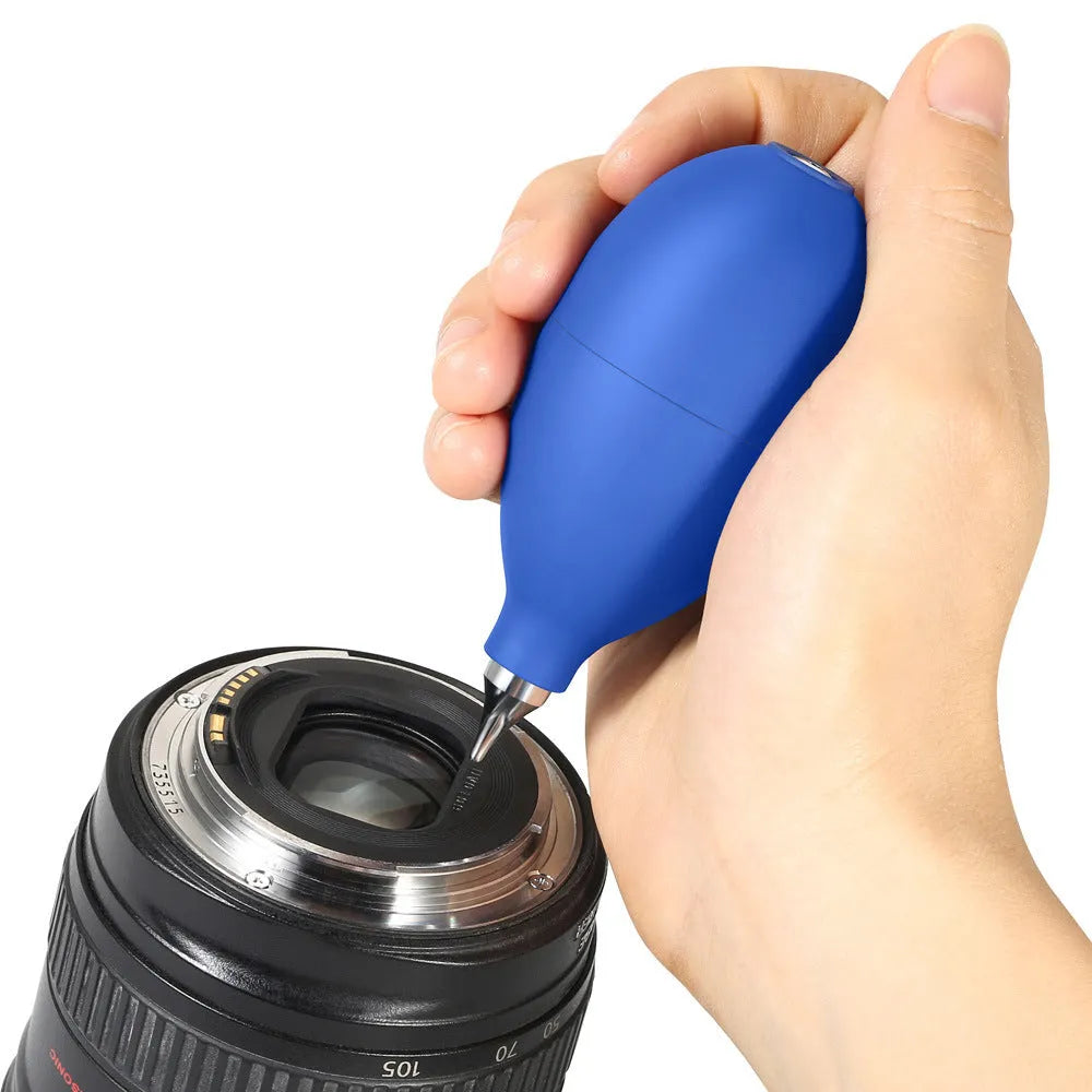 A compact black rubber dust blower with a bulb and nozzle for cleaning cameras and phones.