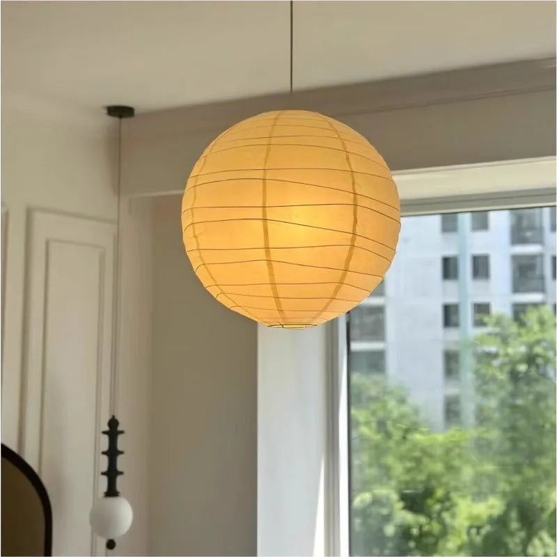 Japanese-style rice paper pendant chandelier in a living room setting.