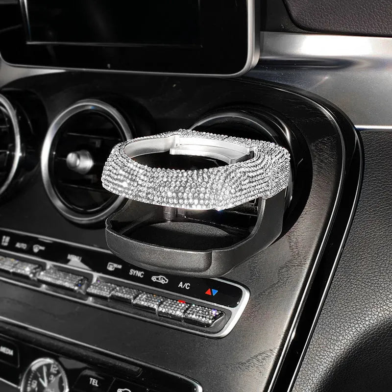 White diamond rhinestone car air vent cup holder bracket showing clip mechanism