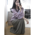 Purple women's blouse with hollow out design and sleeveless princess sleeves on a hanger.