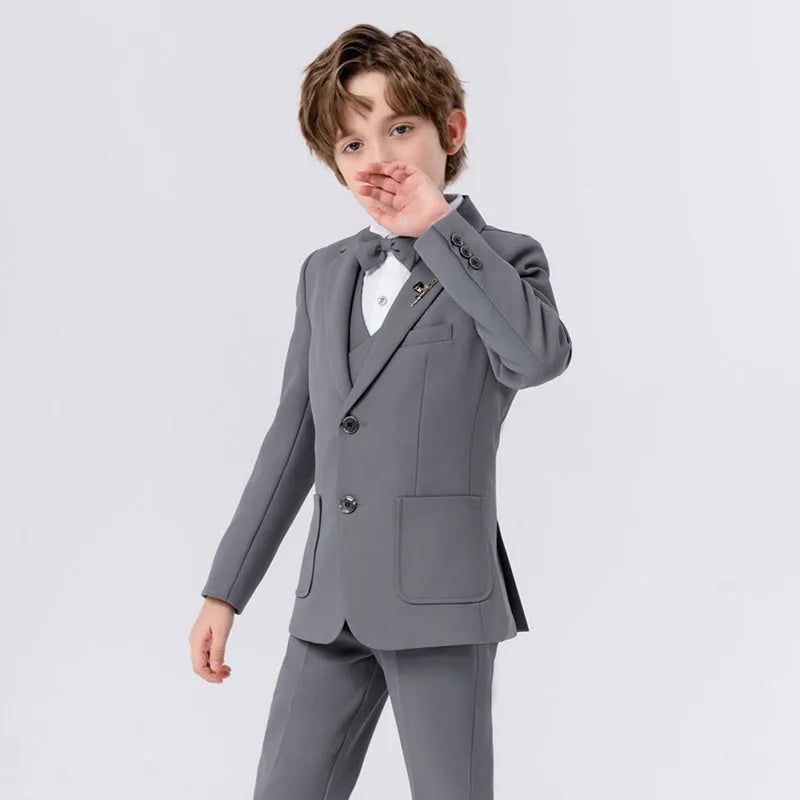 Boys' 5-piece suit set in beige, blue, or grey with coat, trousers, bow tie, vest, and brooch.