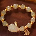Green jade fu character lucky bracelet with hare charm on adjustable black cord