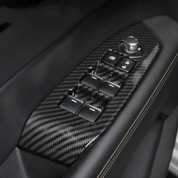 A pair of carbon fibre style ABS plastic steering wheel frames for non-destructive adhesive installation.