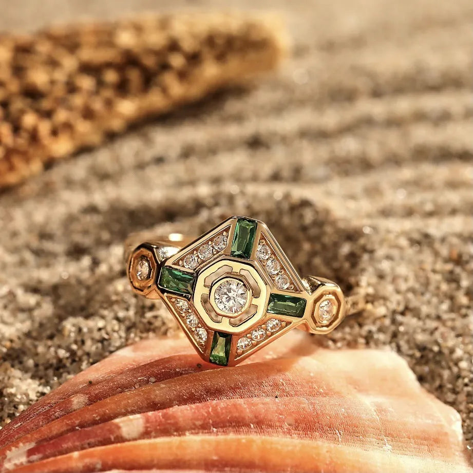Emerald green geometric square-cut women's diamond ring with electroplated finish on a plain background.