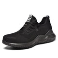 Men's black steel toe safety shoes with low-cut design on a work surface